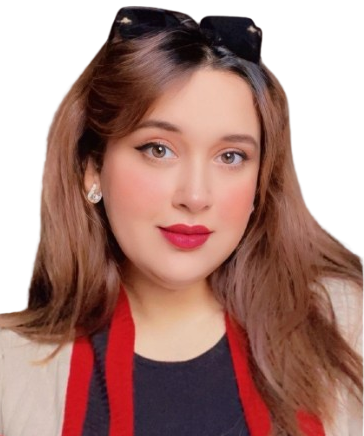 Portrait of a woman with long brown hair, red lipstick, and pearl earrings, wearing a black top and red scarf with sunglasses on her head, looking at the camera.