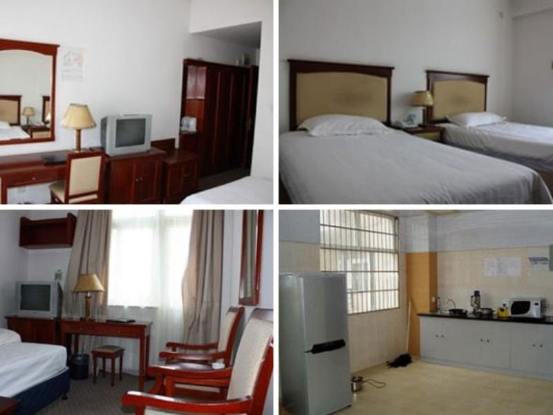 Fujian Medical University international student hostel room, twin-share double room with study desks and wardrobes at Qishan Campus, Fuzhou