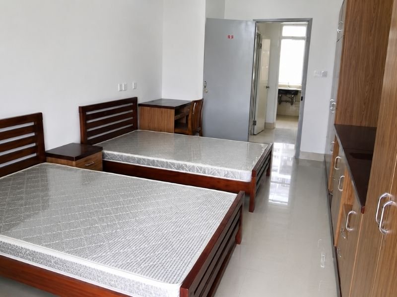 Fujian Medical University international student hostel room, twin-share double room with study desks and wardrobes at Qishan Campus, Fuzhou